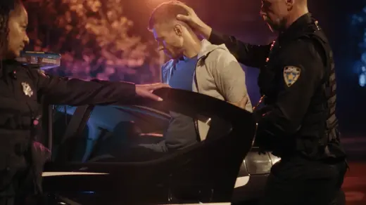Image of a person being arrested for a DUI